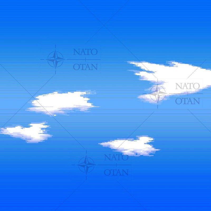 A blue sky with white clouds interspersed with fine horizontal lines and the inscription “NATO OTAN”