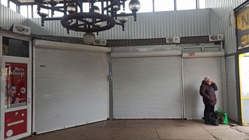 A closed store in a railway station.